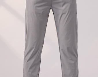 Pantaloni tecnici elasticizzati da uomo - Leggeri, grigi, ideali per jogging, vestibilità slim e viaggi.