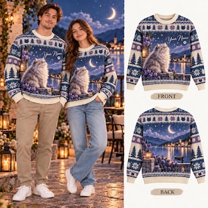 May include: A long-sleeve crewneck jumper featuring a night landscape with a fluffy cat, a crescent moon, and a lake. The design includes a repeating pattern of pine trees and snowflakes in blue, purple, and cream. The text Your Name is visible.