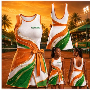 May include: A white tennis dress featuring a vibrant orange and green wave pattern, a scoop neckline, and a waist sash with a large bow. The chest area includes the text YOUR NAME in green. The design includes a wrap-style skirt overlay.