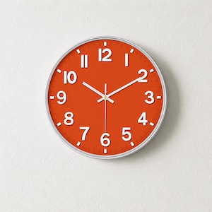 Orange minimalistisk väggklocka, tyst kvartsklocka, modern skandinavisk väggdekor, ljus vardagsrums- och sovrumsklocka för kontoret