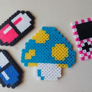 May include: A set of three ceramic mugs with a speckled, matte finish. The mugs are in shades of cream, light gray, and dark gray. Each mug has a simple, minimalist design, perfect for coffee or tea.