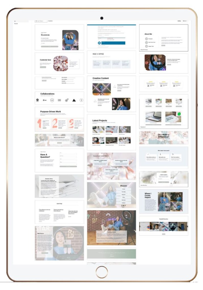 May include: A digital tablet displaying a website layout with various sections. The website includes sections labeled "Blossom," "Collaborations," "Purpose-Driven Work," and "Creative Content." The design incorporates images and text.