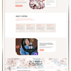May include: A digital tablet displaying a website layout with sections titled "Customer Love" and "What I Offer." The website features text, images of flowers, and a woman with a ring light. The text includes "Brand Development" and "Creative Design."