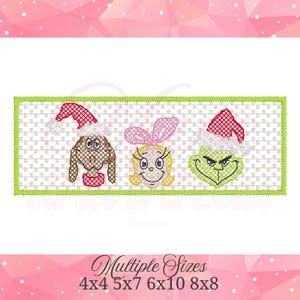 May include: A rectangular embroidery design featuring three characters on a white grid background with a green border. The left character is a brown dog in a red Santa hat, the center is a blonde girl with a pink bow, and the right is a green creature in a red Santa hat.