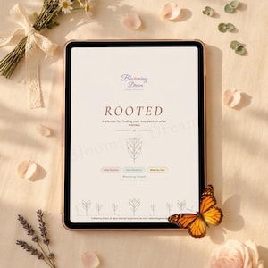 May include: A digital tablet displaying a planner titled Blooming Dream ROOTED, featuring a central leaf illustration, three small rectangular buttons labeled What You Give, What Fills You, and What You Face, and a bottom row of line-art flowers.