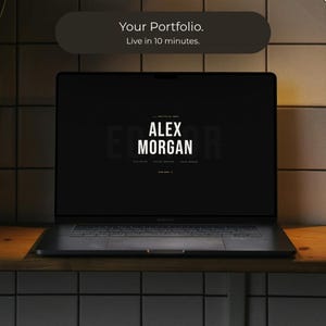 May include: A black laptop displaying a website with the name "ALEX MORGAN" in white text. The laptop is open on a wooden surface, with the text "Your Portfolio. Live in 10 minutes." above the screen.