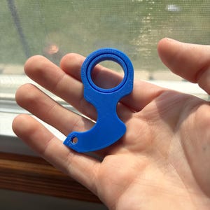 May include: A set of three ceramic mugs with a speckled, matte finish. The mugs are in shades of cream, light gray, and dark gray. Each mug has a simple, minimalist design and a rounded handle. The mugs are suitable for coffee or tea.