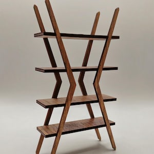 May include: A wooden shelving unit featuring four horizontal shelves supported by two intersecting, V-shaped side frames. The structure is crafted from dark brown wood with a visible grain pattern, creating a geometric, open-frame design.