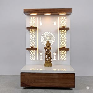 May include: A wooden home temple featuring a white back panel with backlit floral cutouts and an Om symbol. The structure includes four small shelves, a top canopy with three integrated lights, and a base with a drawer, holding a brass Krishna statue.