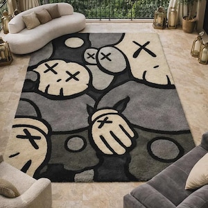 May include: A rectangular area rug featuring a repeating graphic pattern of stylized cartoon characters with X-shaped eyes and gloved hands. The design uses a palette of charcoal gray, light gray, and cream, with bold black outlines defining the shapes.