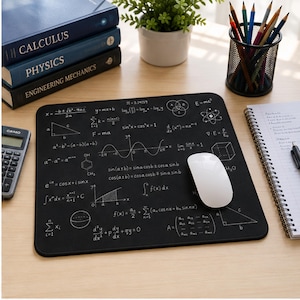 May include: A rectangular black mouse pad featuring white printed mathematical formulas, geometric shapes, and scientific equations. The surface displays various calculus, physics, and algebra notations, including the quadratic formula, sine waves, and integrals.