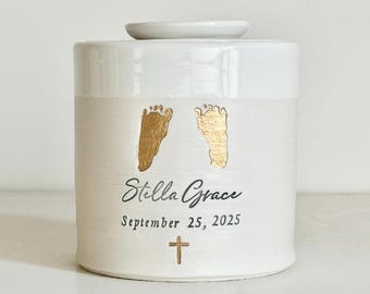 Custom cremation urn, larger sizes. Child memorial with footprints and cross shown.