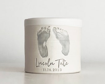 custom infant urn with optional custom footprint. Flat lid Urn shown with personalized name and date.  baby feet urn