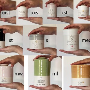 image of various urn sizes, each held in the hand for scale. the urns are all available in several sizes, some sizes might be found in other listings in the vitrifiedstudio custom urn shop.