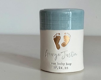 personalized baby urn with optional custom footprint . Light blue Boy shown