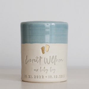 custom infant urn or Custom child urn. Light blue urn shown with personalized name and date. Baby Boy urn for ashes