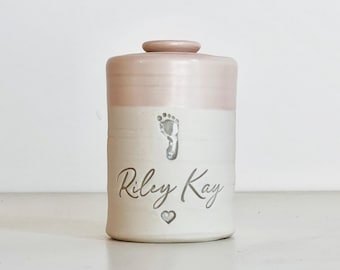 Personalized infant urn with optional custom footprint shown.