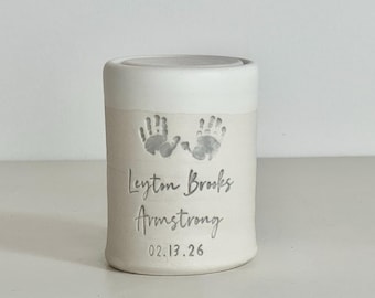personalized baby urn with optional custom handprint .