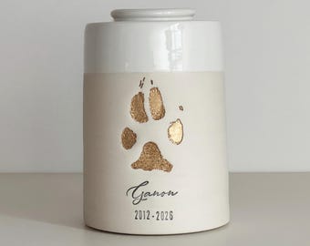 Custom cremation pet urn shown with custom paw stamp