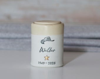 Personalized keepsake urn with cowboy hat and optional gold star shown