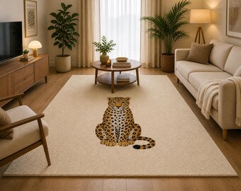 May include: A cream-colored area rug featuring a large, detailed illustration of a leopard. The leopard is depicted in shades of brown and black, with a textured, spotted pattern. The rug is placed in a living room setting.