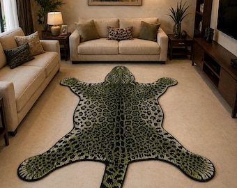 May include: A green and black leopard print rug in the shape of a jaguar, with a detailed head and paws. The rug is placed on a light-colored floor in a living room setting, with beige sofas and wooden furniture in the background.