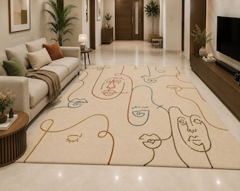 May include: A rectangular area rug featuring a cream-colored base with a continuous line art pattern depicting multiple abstract human faces. The design incorporates thin, flowing lines in shades of rust orange, deep blue, and dark green.