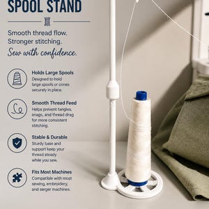 May include: A white single thread spool stand with the text "SINGLE THREAD SPOOL STAND". The stand holds a spool of white thread. The stand is designed to hold large spools or cones securely in place and is compatible with most sewing machines.