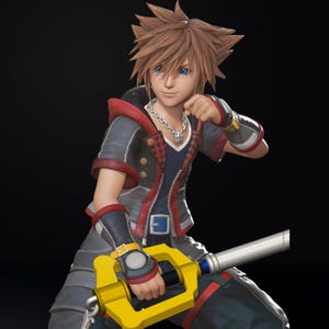 May include: A detailed figurine of a character with spiky brown hair and blue eyes, wearing a black and red jacket with a silver chain necklace. The character is holding a yellow and silver key-shaped weapon, set against a dark background.
