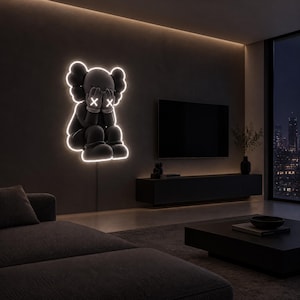 May include: A wall-mounted neon light fixture shaped like a cartoon character with rounded ears and hands covering its face. The character features glowing white outlines and white X symbols for eyes, emitting a bright light against the wall.