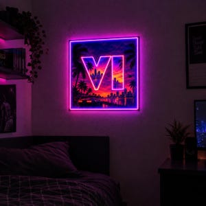 May include: A square wall-mounted LED neon sign featuring a vibrant sunset cityscape with palm trees, a sports car, and the large glowing letters VI in the centre. The artwork is illuminated by a bright pink and purple neon light border.