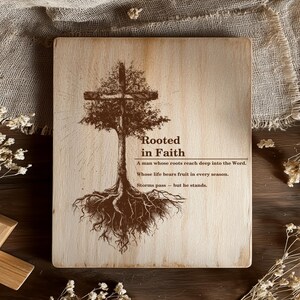 May include: Wooden plaque with a tree and cross design. The artwork is in brown tones and features the text "Rooted in Faith" along with inspirational quotes. The plaque is a square shape.