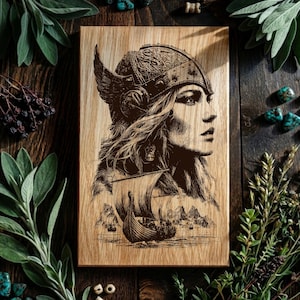 May include: Wooden plaque featuring a detailed engraving of a woman in a winged helmet, with a Viking ship sailing on the sea. The artwork is in shades of brown and is set against a wooden background, evoking a historical theme.