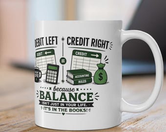 May include: A white ceramic mug featuring black and green graphics of accounting elements including a calculator, ledger, and money bag. The text reads: DEBIT LEFT CREDIT RIGHT because BALANCE ISN'T JUST IN YOUR LIFE. IT'S IN THE BOOKS!
