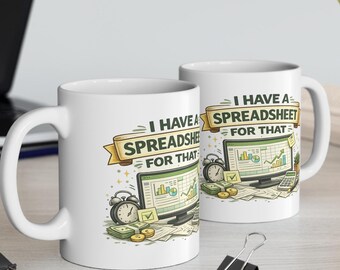 May include: Two white ceramic mugs featuring a graphic illustration of a computer monitor displaying charts, a clock, and stacks of money. The text "I HAVE A SPREADSHEET FOR THAT" is printed in bold letters on a yellow banner above the computer screen.