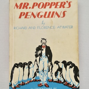 May include: Vintage book cover for "Mr. Popper's Penguins" by Richard and Florence Atwater. The cover features a cartoon illustration of a man in a tuxedo with a group of penguins. The title is in red, and the author's names are in blue.