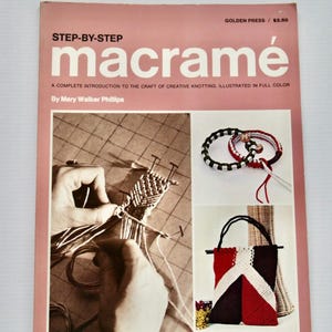 May include: A vintage book cover titled "macramé" with a pink border. The cover features the text "STEP-BY-STEP macramé" and illustrations of macramé projects, including bracelets and a handbag. The book is by Mary Walker Phillips.