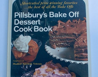 May include: A vintage cookbook titled "Pillsbury's Bake Off Dessert Cook Book" with a photo of a chocolate cake and a cherry pie on the cover. The book is a compilation of prize-winning recipes from Pillsbury's Bake Off contests.  Compliments of Disabled American Veterans.