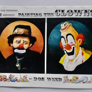 May include: A painting of two clowns, one with a sad expression and the other with a happy expression. The painting is titled "Painting the Clowns" by Don Weed.