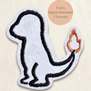 May include: A white embroidered patch in the shape of a cartoon creature with a black outline. The creature has a flame-shaped tail with orange and yellow embroidery. The patch has the text "3 sizes Digital Download 7 Formats".
