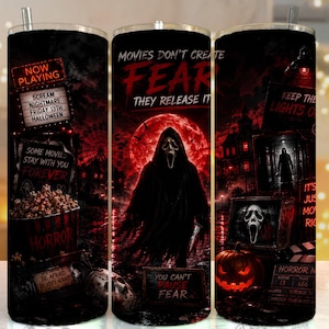May include: A cylindrical tumbler featuring a dark horror-themed graphic with a central cloaked figure, a red moon, and text including "MOVIES DON'T CREATE FEAR THEY RELEASE IT," "NOW PLAYING," "SCREAM," "NIGHTMARE," "FRIDAY 13TH," and "HALLOWEEN."