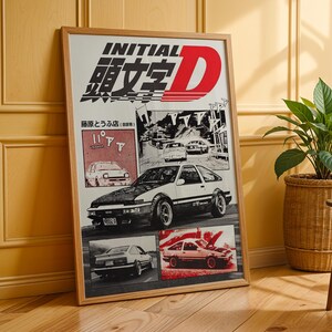 May include: A framed poster featuring the text "INITIAL D" in bold letters with a red "D". The poster showcases illustrations of a white and black sports car, along with other car illustrations in a comic book style. The poster is in a wooden frame.