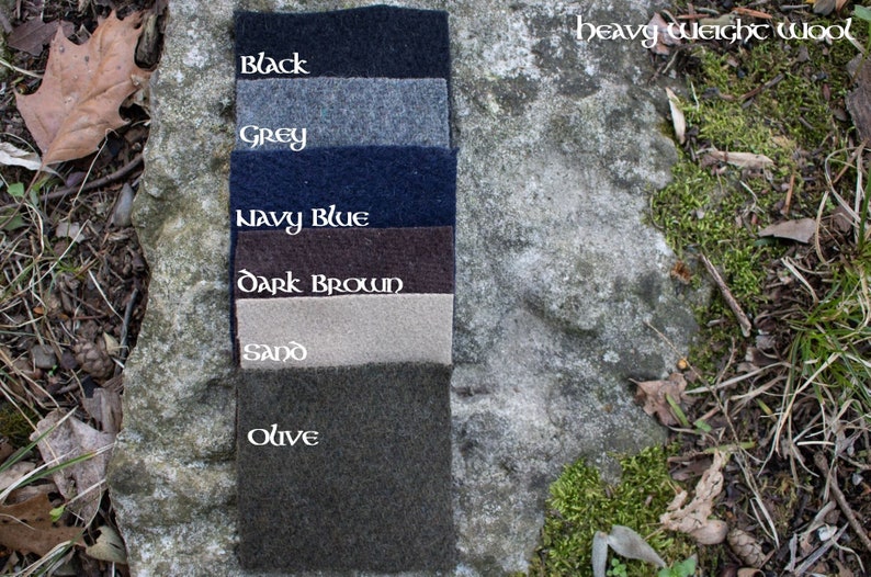 May include: Six fabric swatches of heavy weight wool in the colors black, grey, navy blue, dark brown, sand, and olive.