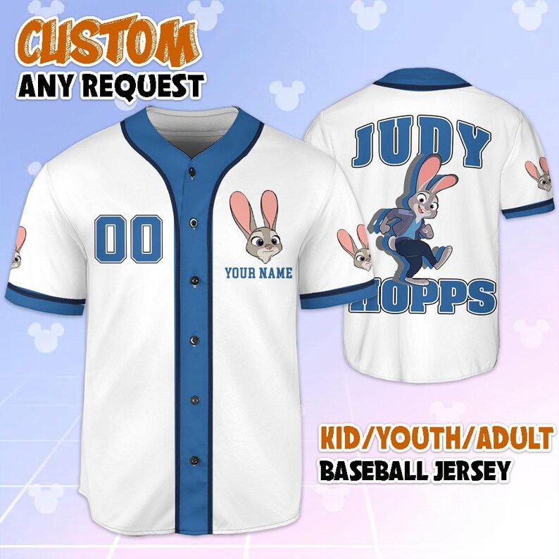 May include: White baseball jersey with blue trim, showcasing a cartoon rabbit character. The jersey displays "JUDY HOPPS" on the back and "00" on the front. The text "CUSTOM ANY REQUEST" and "YOUR NAME" are also visible.