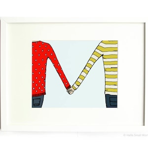 May include: Two people holding hands, one wearing a red sweater with white polka dots and the other wearing a yellow and white striped sweater. The image is framed in white.