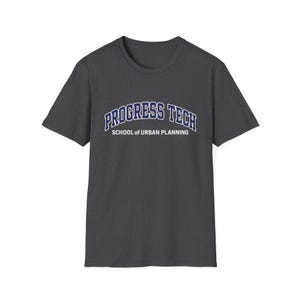 May include: Dark gray t-shirt with the text "PROGRESS TECH SCHOOL OF URBAN PLANNING" in a blue and white arched design. The shirt has short sleeves and a crew neck.