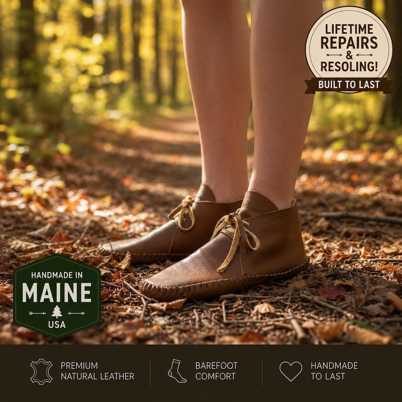 May include: Brown leather moccasin-style shoes with tan laces and visible stitching along the sole. Text overlays include "LIFETIME REPAIRS & RESOLING! BUILT TO LAST" and "HANDMADE IN MAINE USA" along with icons for premium leather and barefoot comfort.