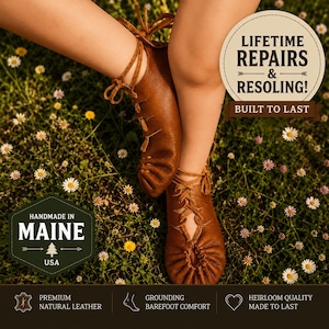 May include: Brown leather moccasins with lace-up detailing. The image includes text that says "Handmade in Maine USA", "Lifetime Repairs & Resoling! Built to Last", "Premium Natural Leather", "Grounding Barefoot Comfort", and "Heirloom Quality Made to Last".