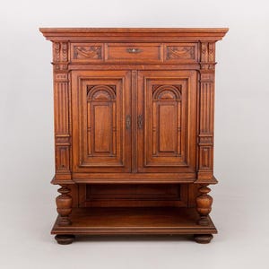 May include: A set of three ceramic mugs with a speckled, matte finish. The mugs are in shades of cream, light gray, and dark gray. Each mug has a simple, minimalist design, perfect for coffee or tea.