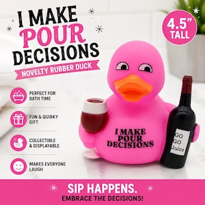 May include: A bright pink rubber duck standing 4.5 inches tall, holding a wine glass in one wing and a black wine bottle labeled 'GO GO JUICE' in the other. The duck features an orange beak and black text on its chest reading 'I MAKE POUR DECISIONS'.